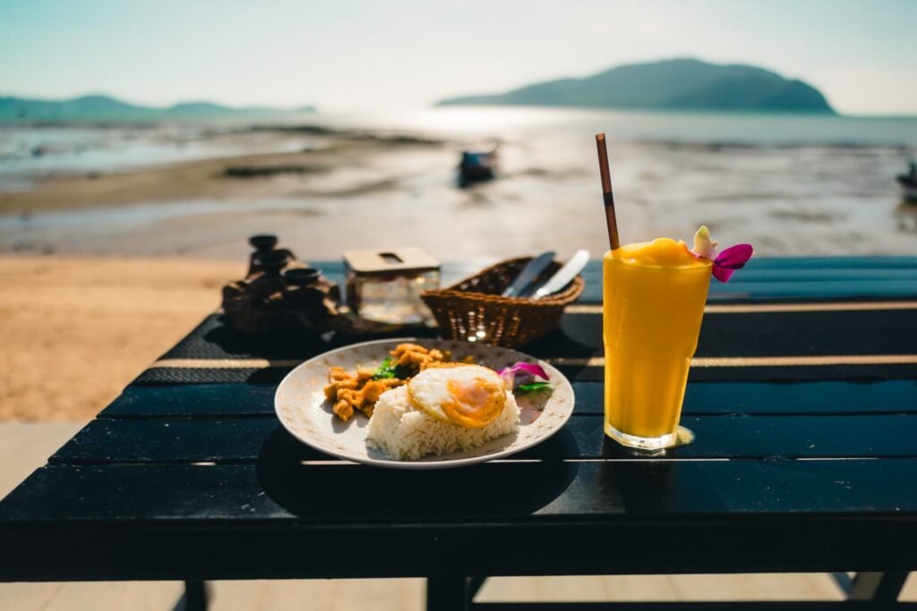 Affordable beachside meal and mango smoothie in Thailand