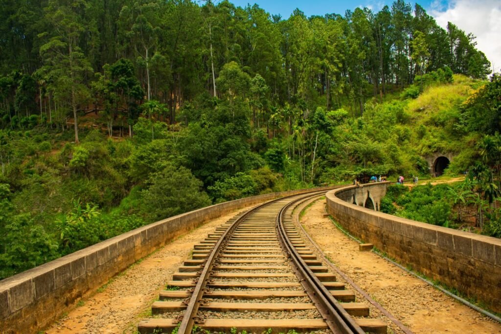 Nine Arch Bridge railway tracks through green forest in Ella Sri Lanka