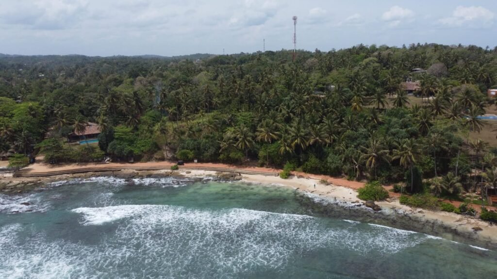 Aerial drone view of tropical beach coastline in Sri Lanka